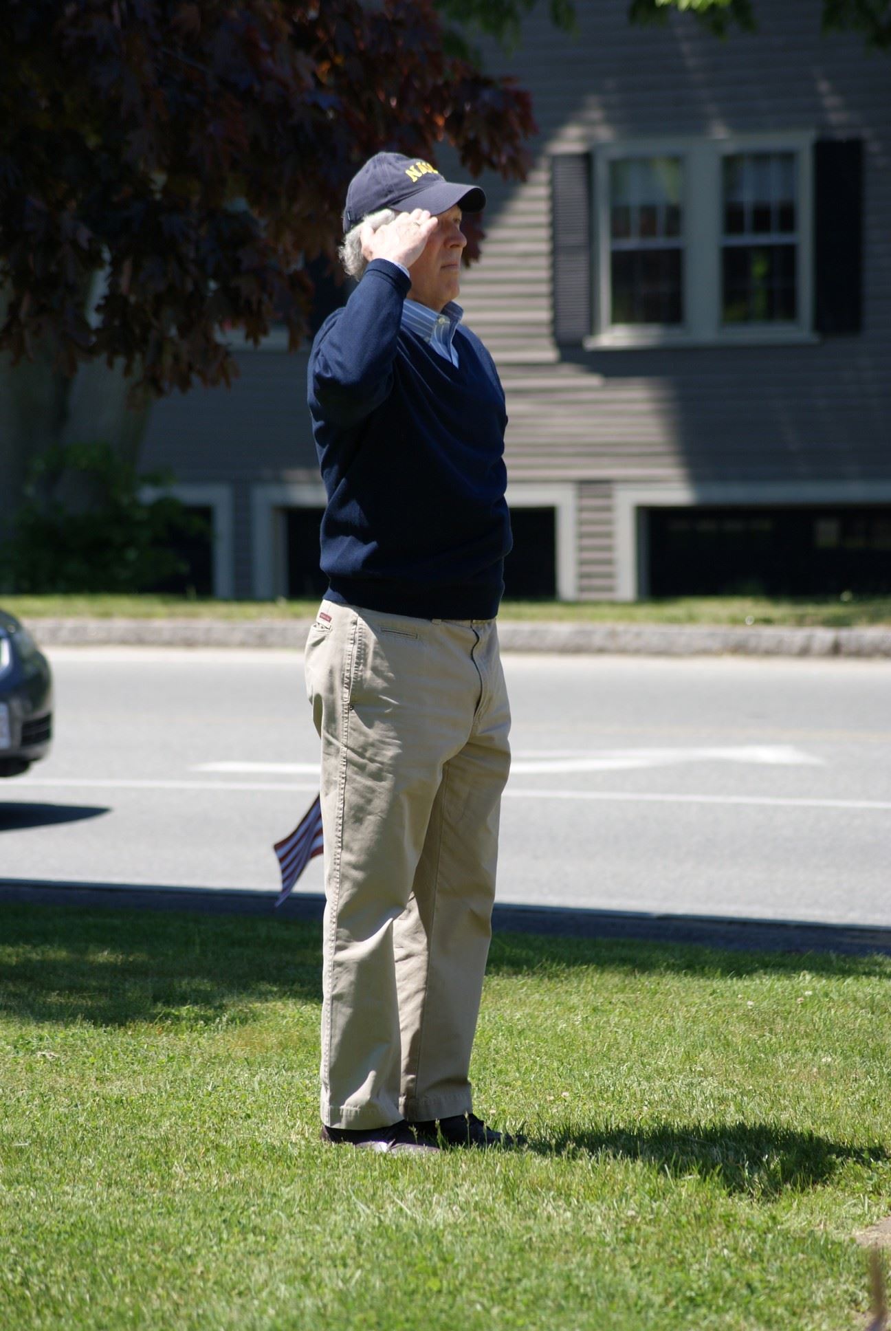 US Navy Veteran Mr. Asher salutes the flag